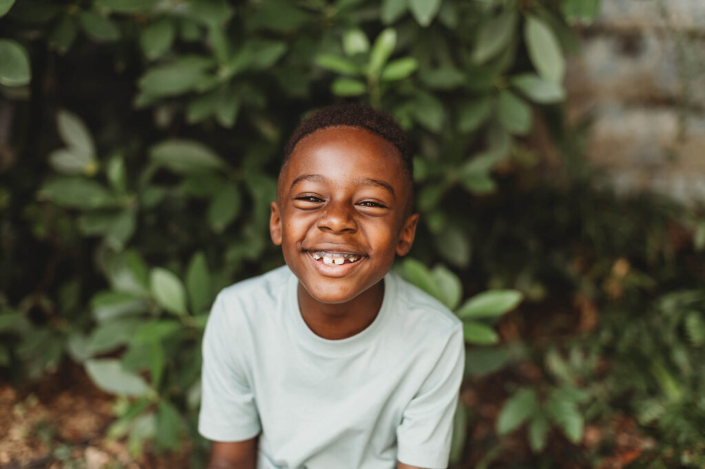 Happy child flashing a big smile, natural child portrait