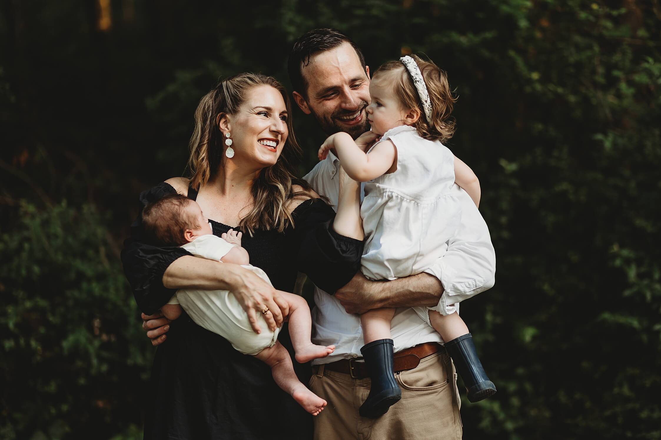 Lifestyle newborn session at Garrard Landing Park with baby boy and family