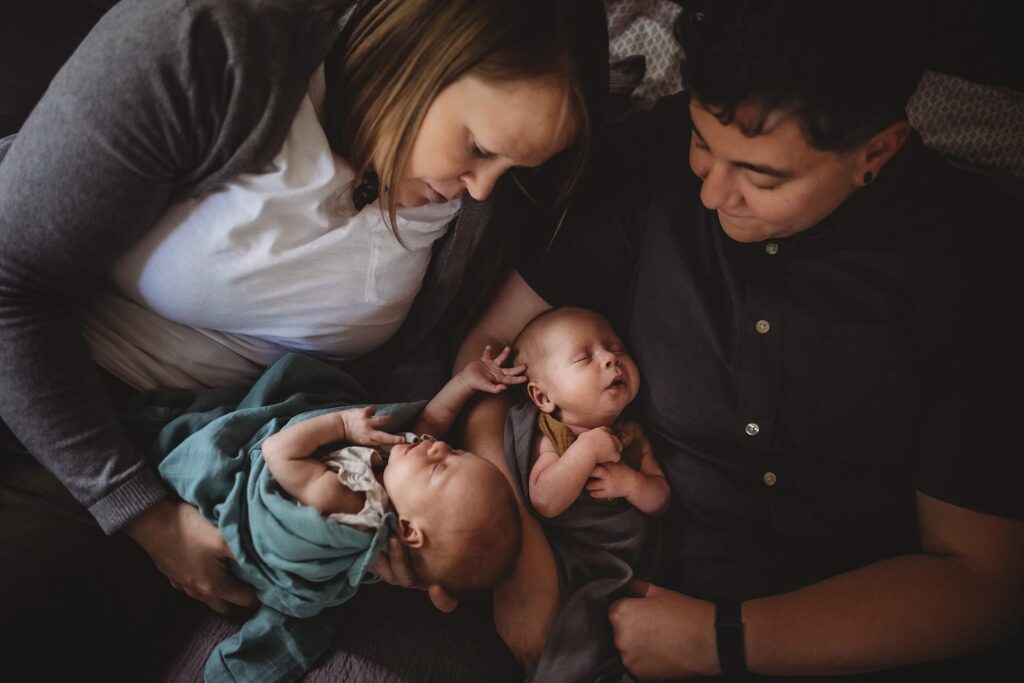 Two moms with their newborn twins photographed at home in Sandy Springs, GA
