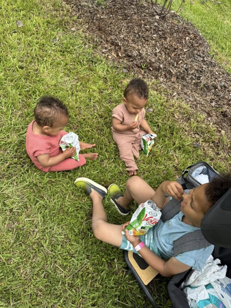 Taking a snack break in the shade during a summer morning at Feldwood Farms.