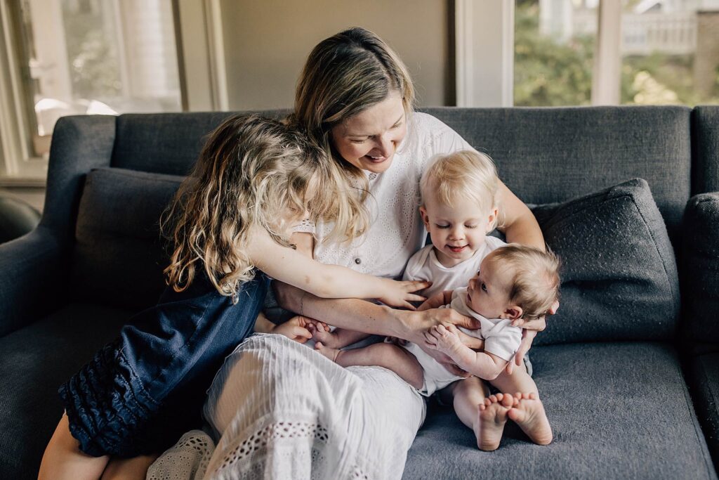 Mother with three children illustrating childcare needs for growing families