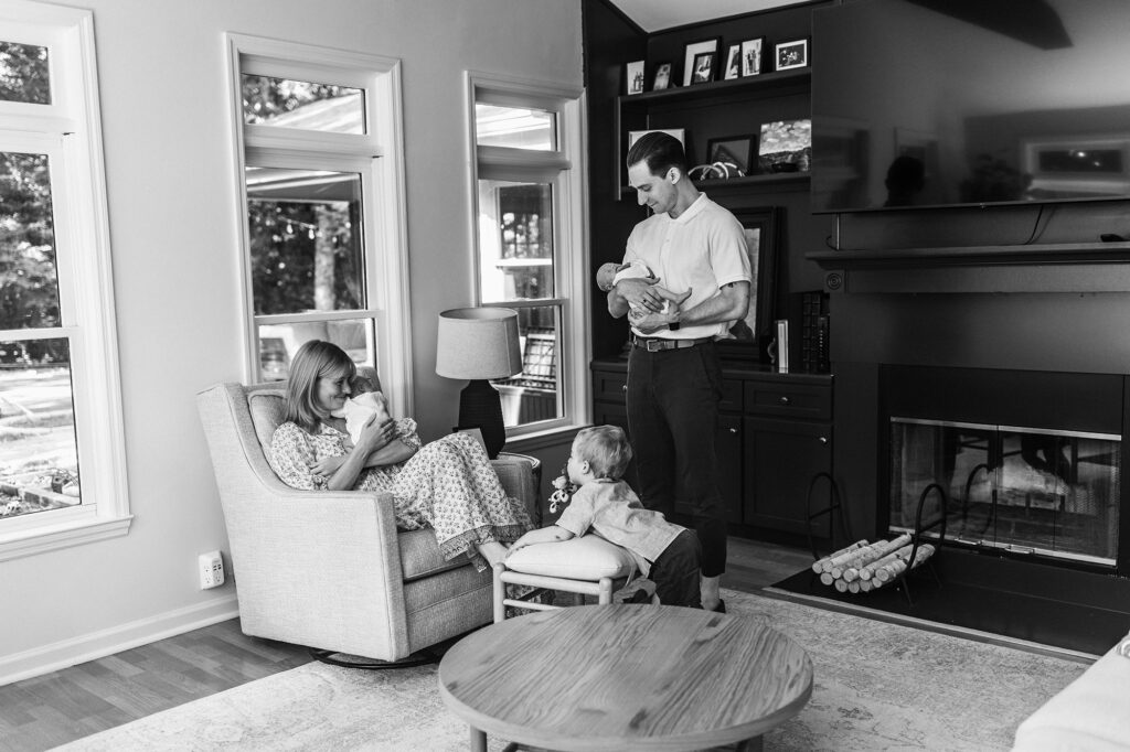 Family with newborn twins and toddler discussing options for nannies in Atlanta.