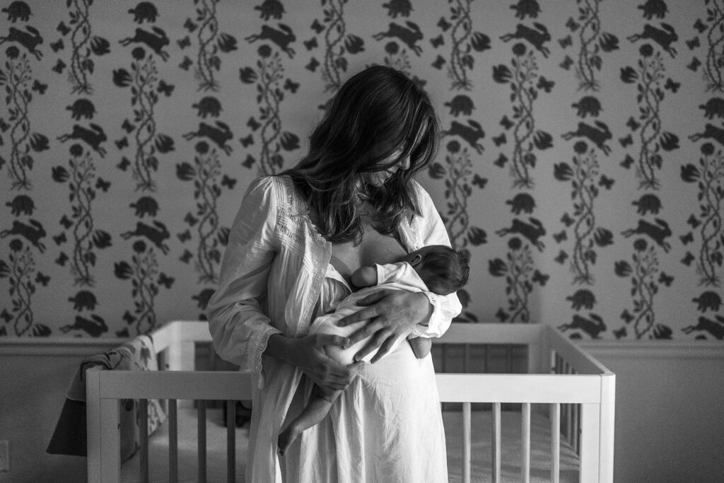 Mom nursing in a white gown